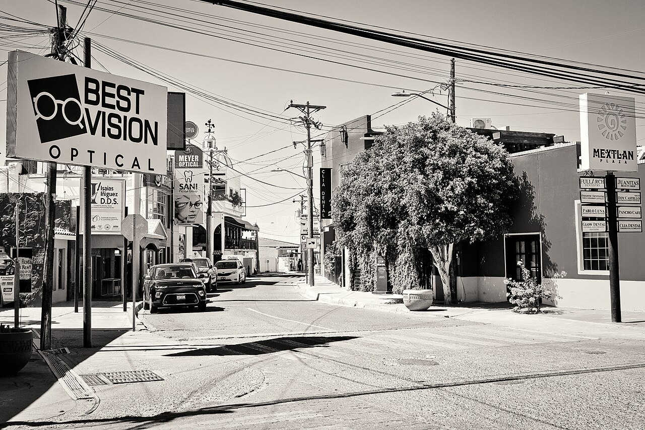 Street in Los Algodones with dental clinic signs