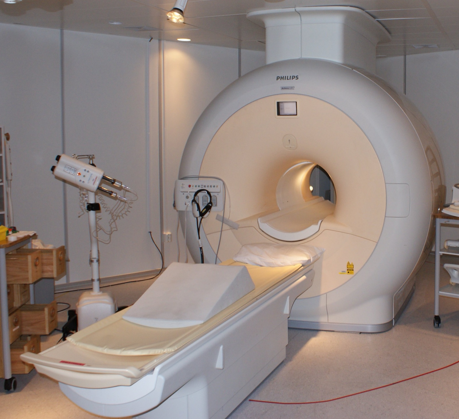High-field MRI scanner in an empty hospital imaging room